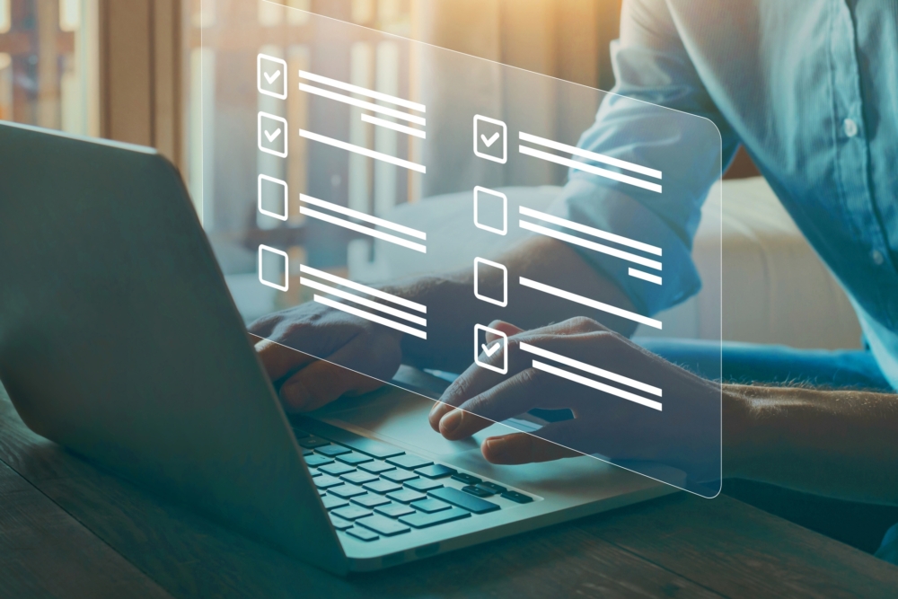 Hands typing on a laptop with a quiz overlay hovering above