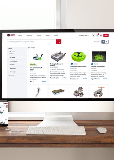 A desk with multiple devices showing an e-commerce site.