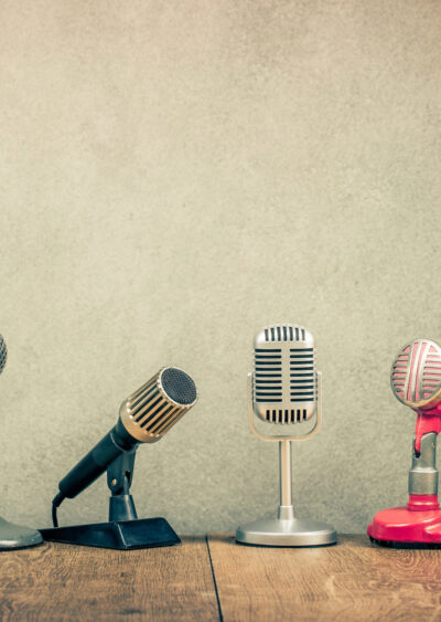 6 microphones on wood with textured background