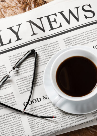 Daily Newspaper with coffee and glasses