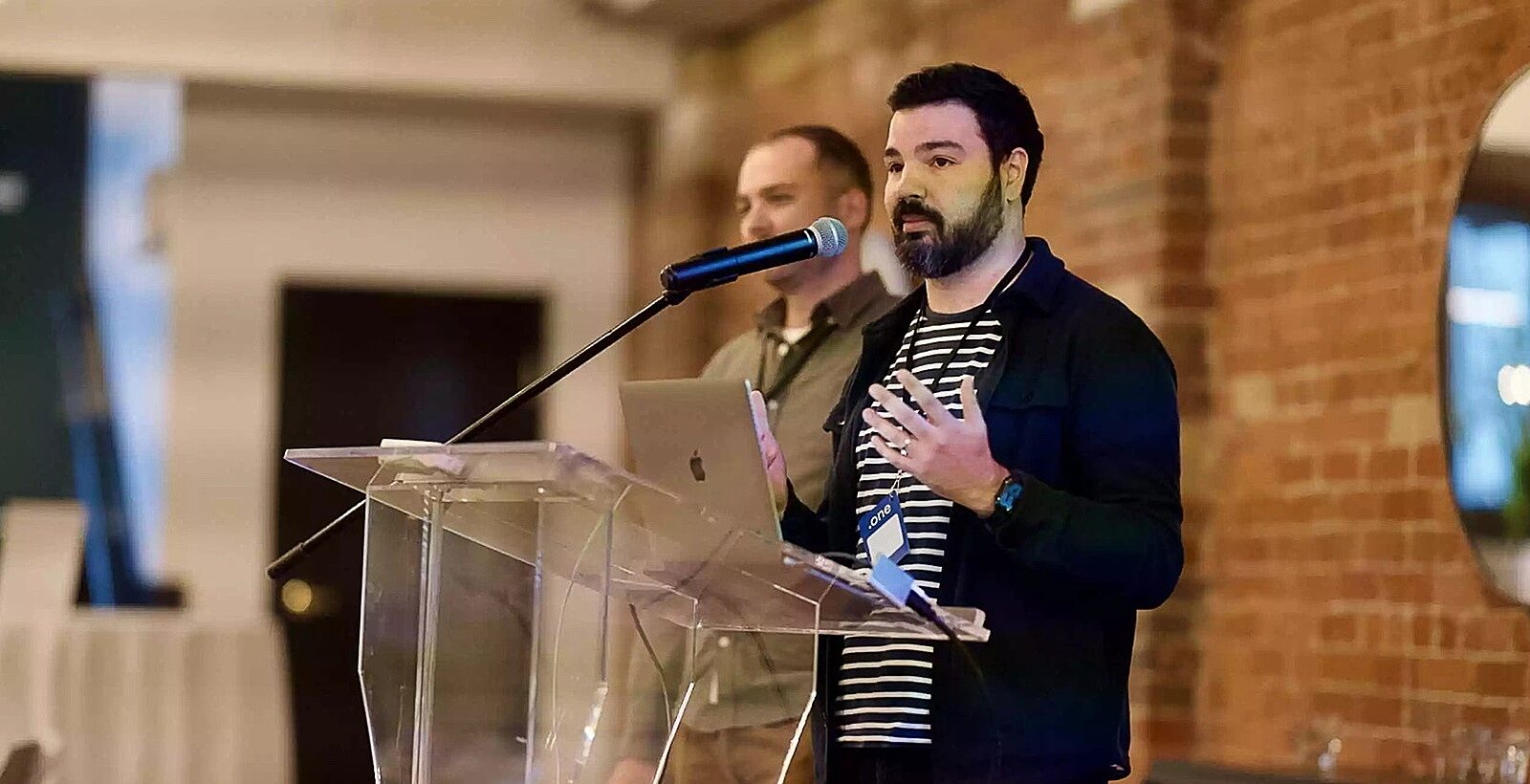 Two members of the Motum B2B team presenting at Dot One.