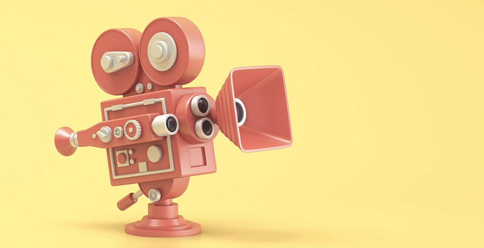 Red movie camera on yellow background.