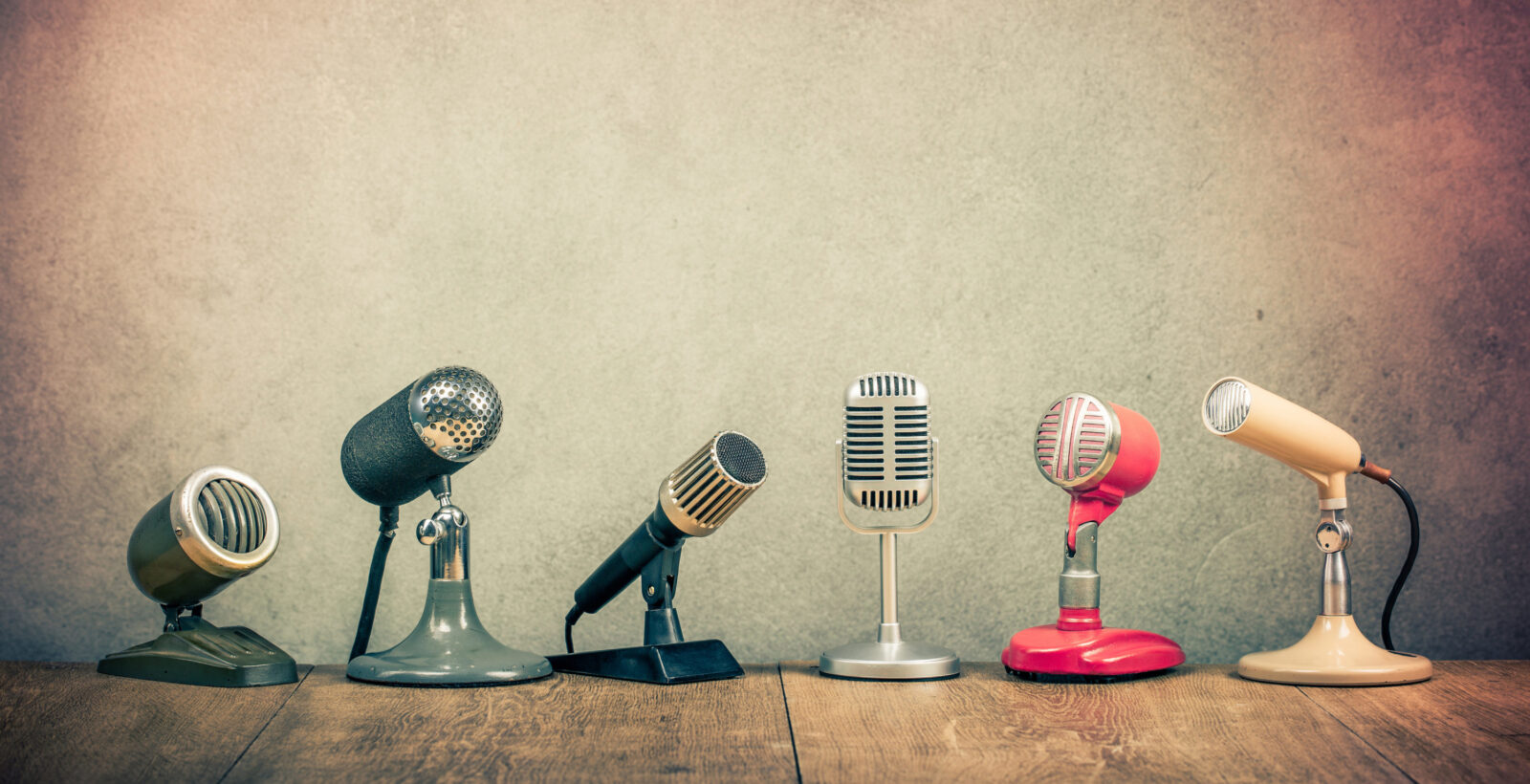 6 microphones on wood with textured background