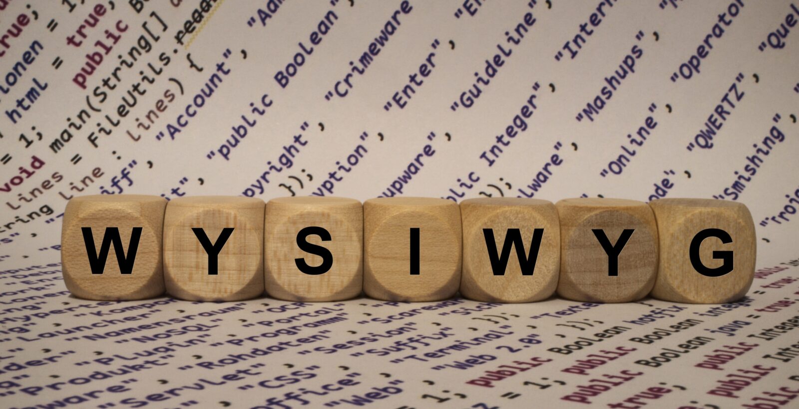 WYSIWYG on Wooden Dice with internet terms printed on paper