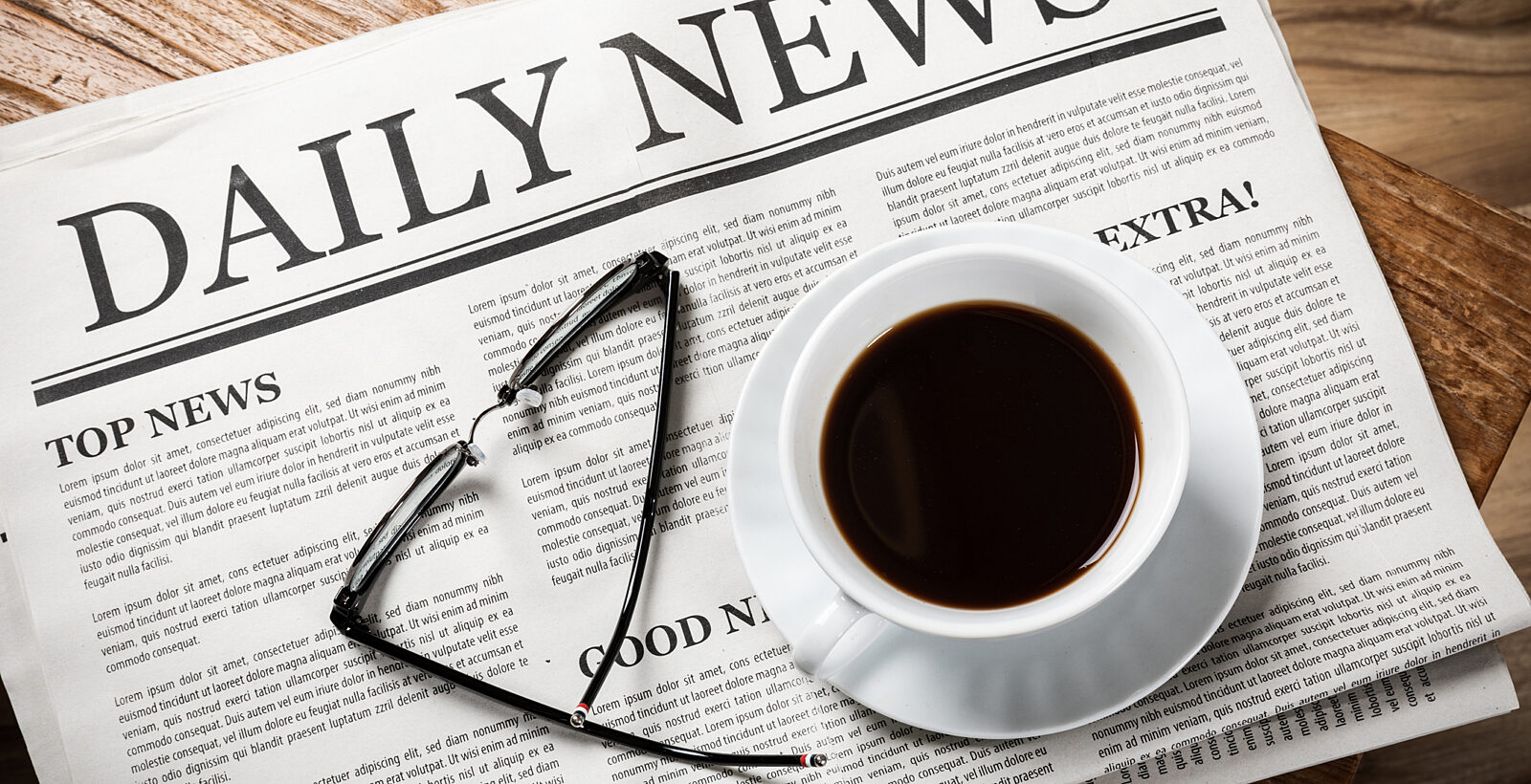 Daily Newspaper with coffee and glasses